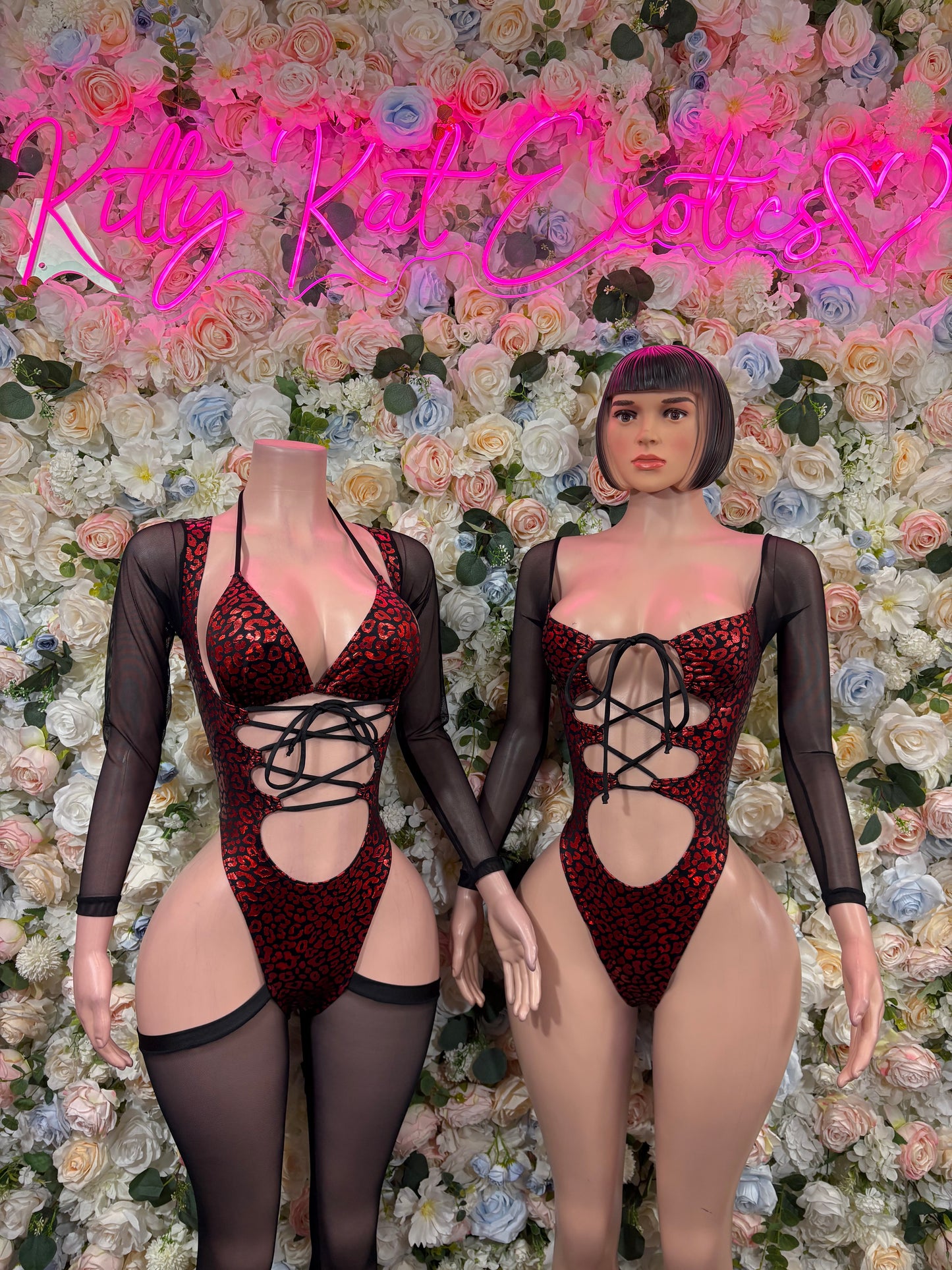 Red metallic cheetah-pattern bodysuit with crisscross lace front, thigh cutouts, sheer sleeves