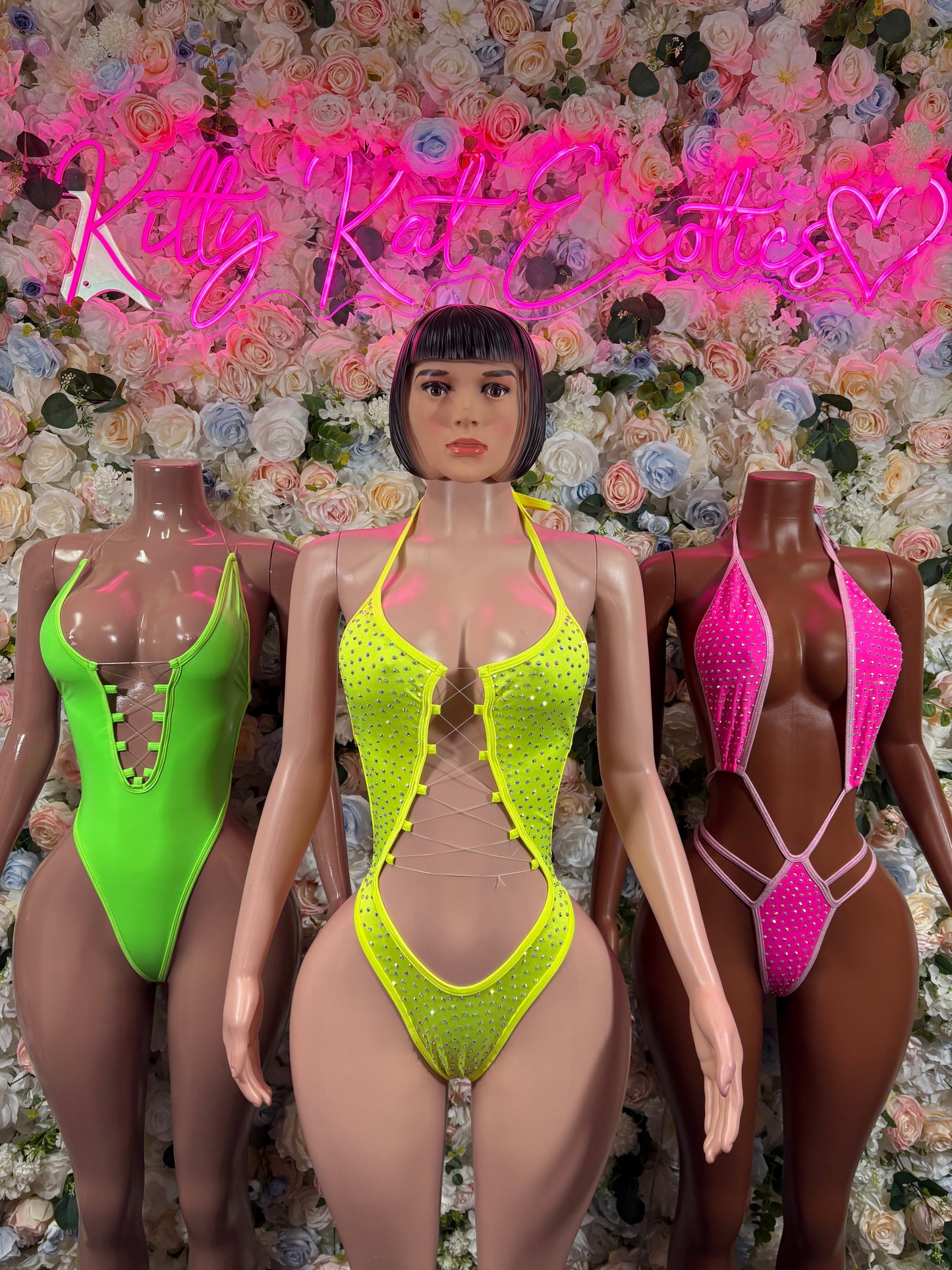 Neon green high-cut one-piece with strappy front and decorative trim