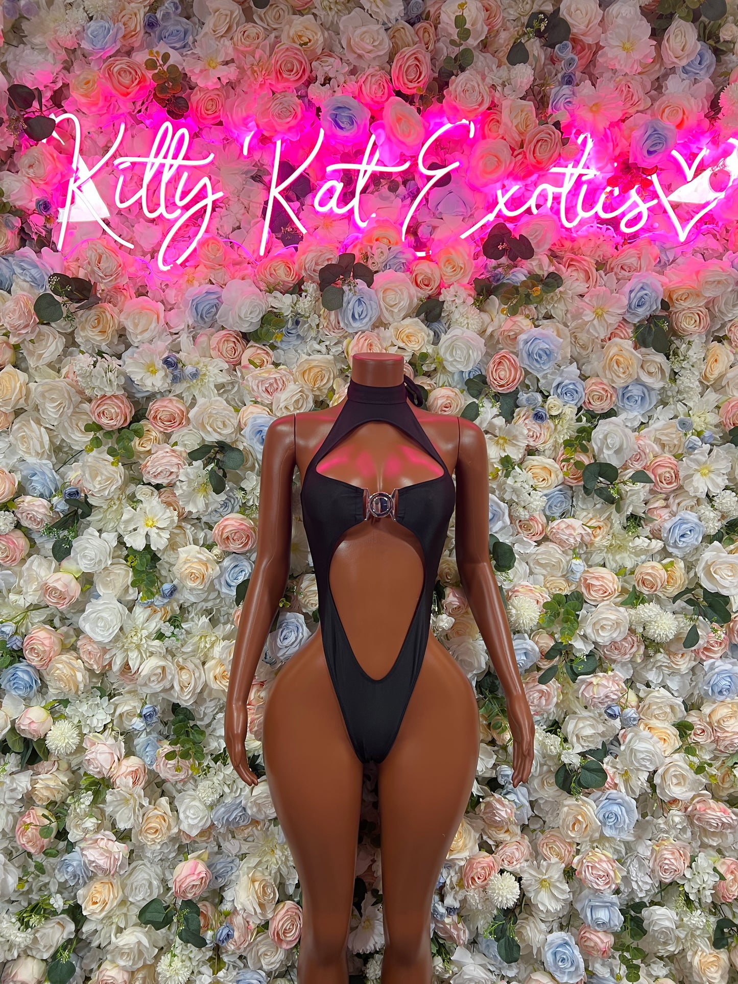 Black one-piece rave bodysuit with back cutout and halter neck front