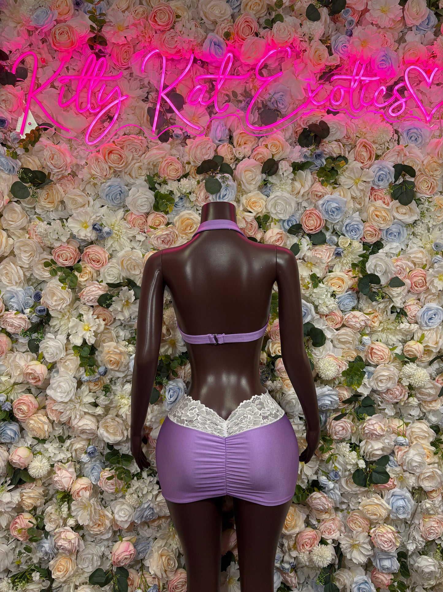 Purple satin two-piece lingerie set with lace-trim mini skirt and back bodysuit