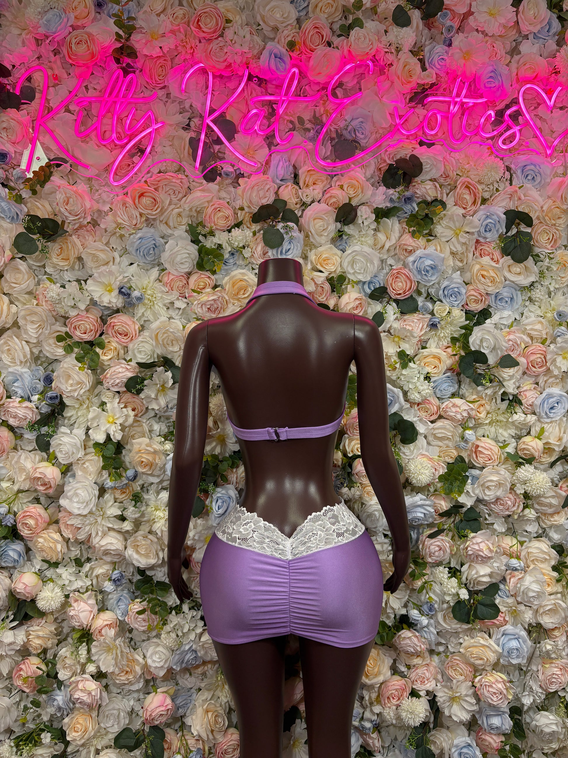 Purple satin two-piece lingerie set with lace-trim mini skirt and back bodysuit