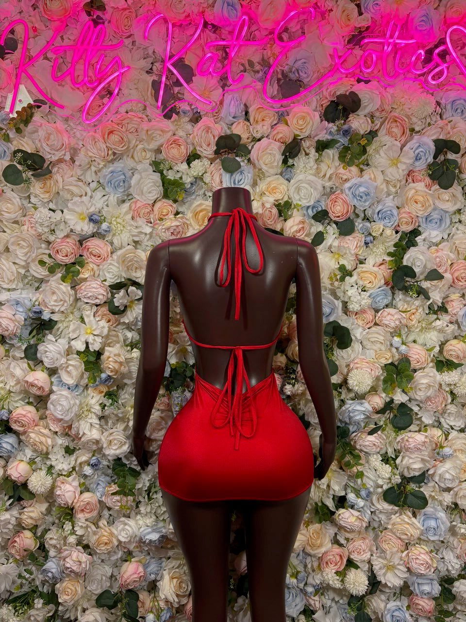 Red mini bodycon dress back with halter tie straps and cutout neckline