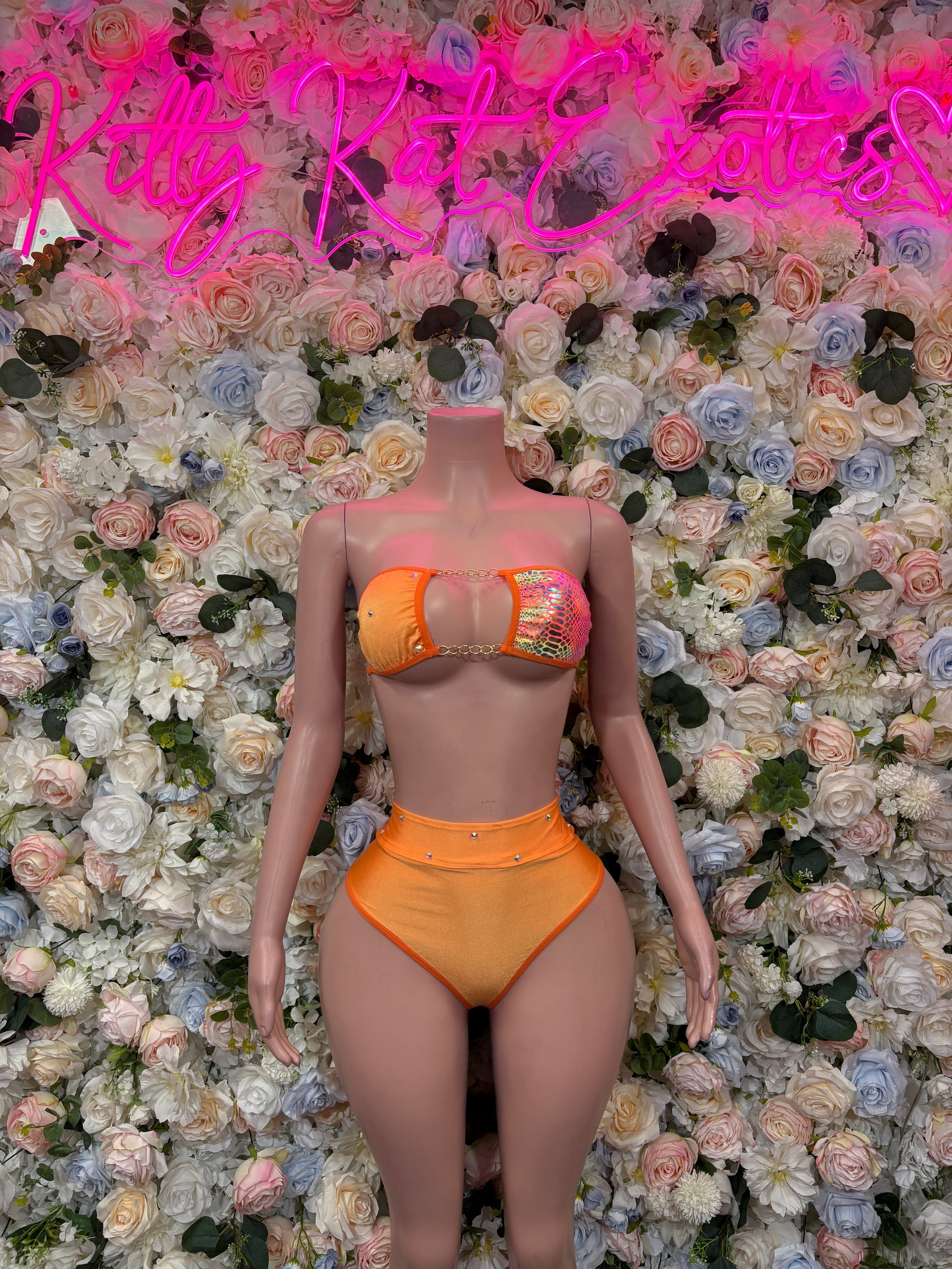 Orange two-piece dancewear set with jeweled triangle bikini top and high-cut briefs