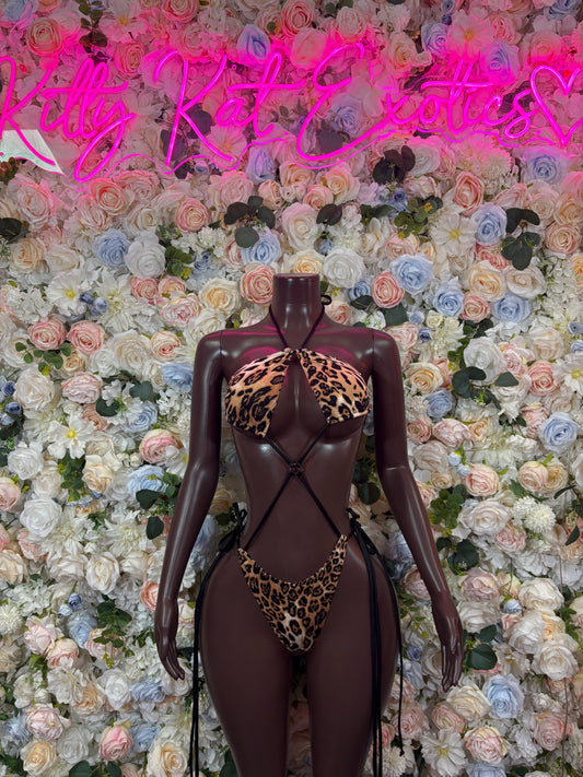 Dark one-piece bodysuit with leopard-print thong front and open back straps