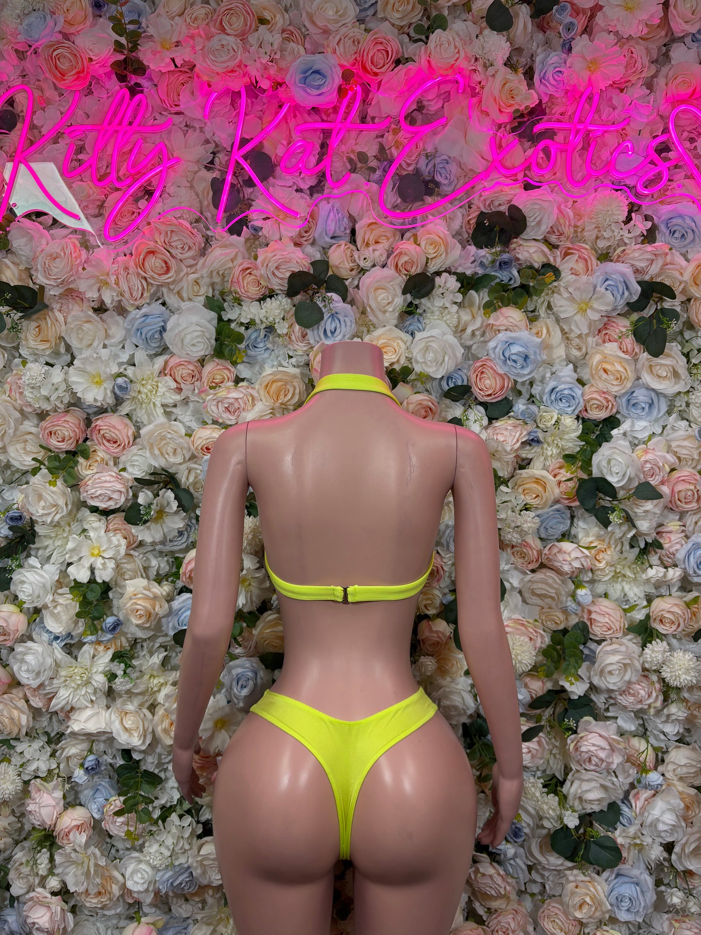 Back view of yellow lace triangle bikini set with neon green straps and matching briefs