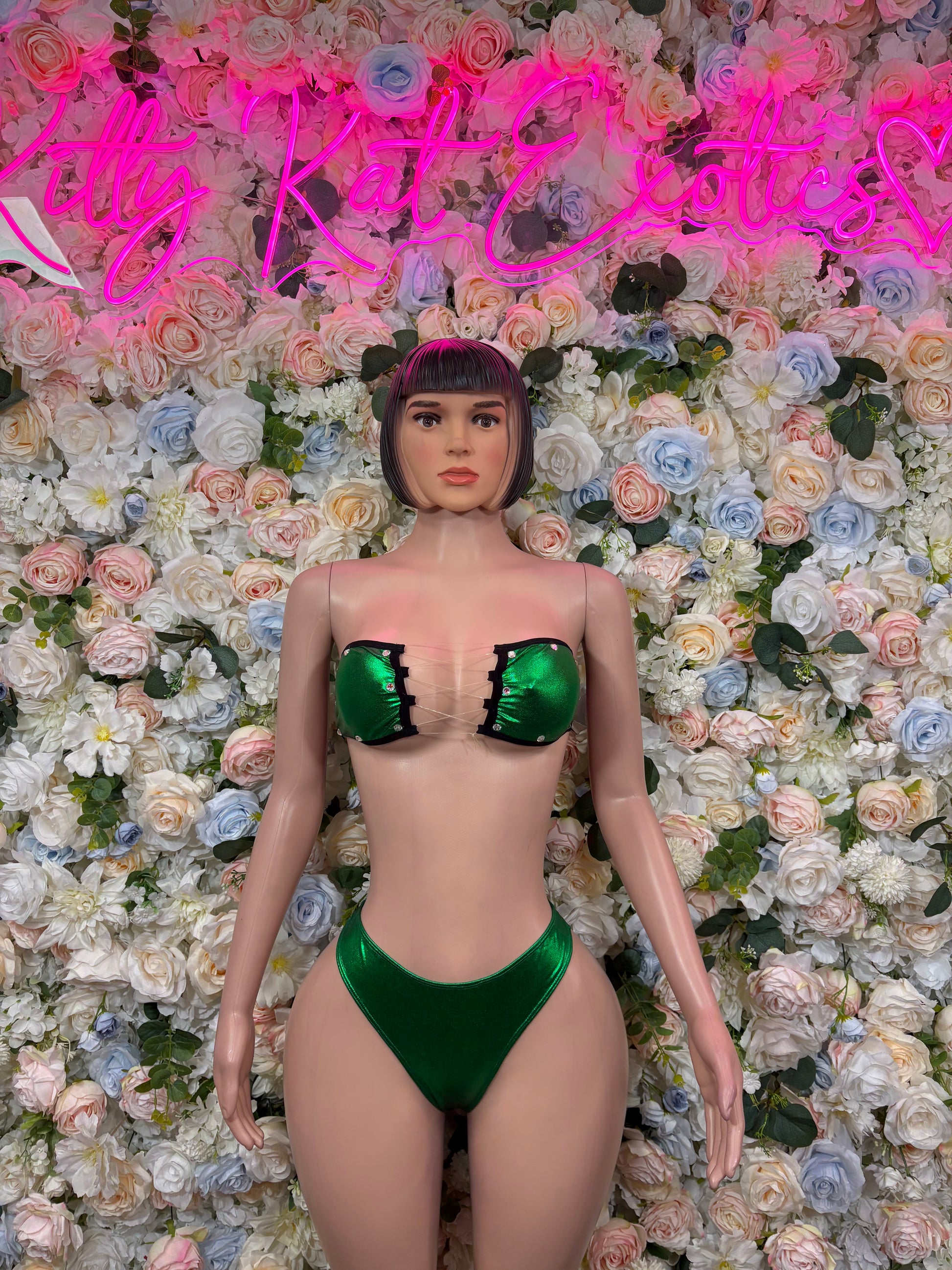 Green bikini two-piece set with mirrored bandeau and high-cut bottoms