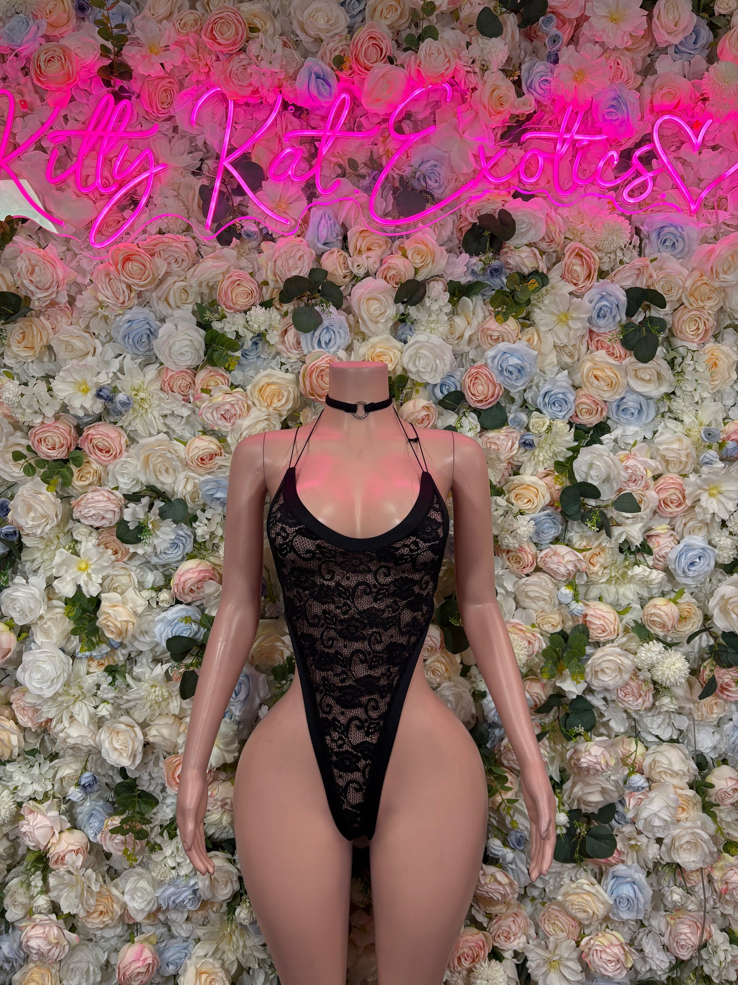 Black lace bodysuit with spaghetti straps and high-cut thong back