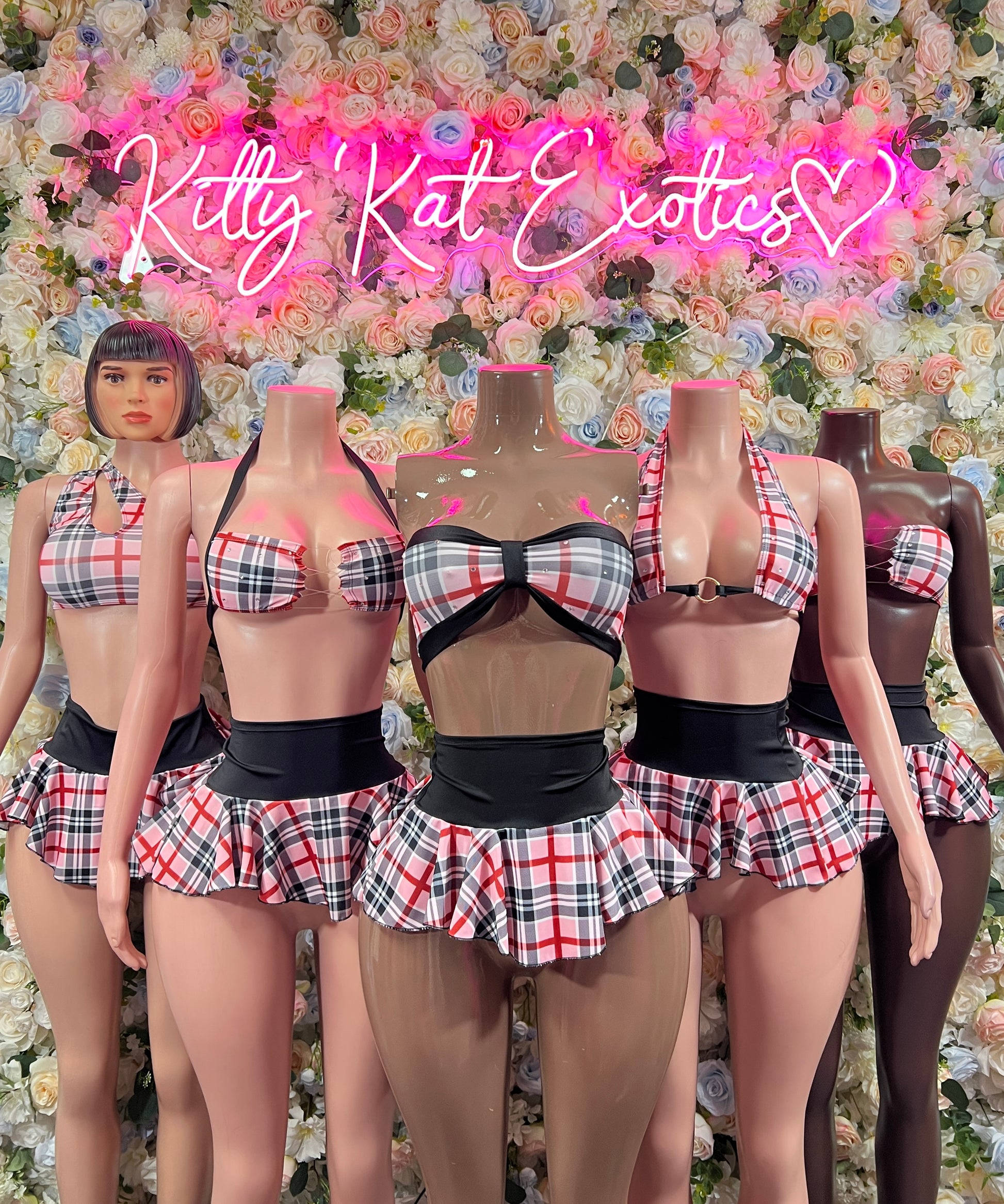 Pink plaid two-piece skirt set shown on models: underwire bra and pleated mini skirt