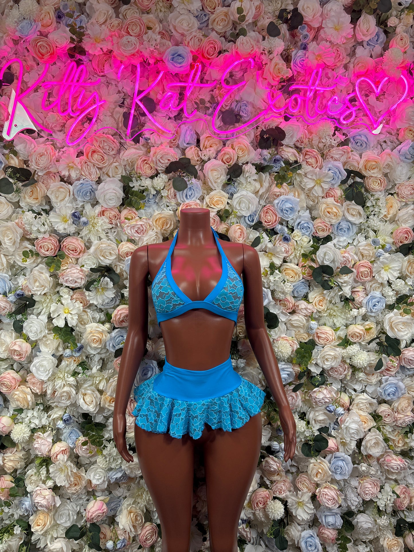 Blue lace bralette and ruffled mini skirt set, front view on model