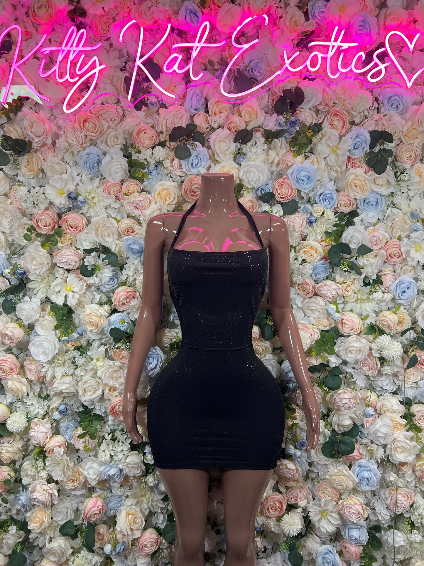 Black fitted mini club dress with thin straps and sweetheart neckline
