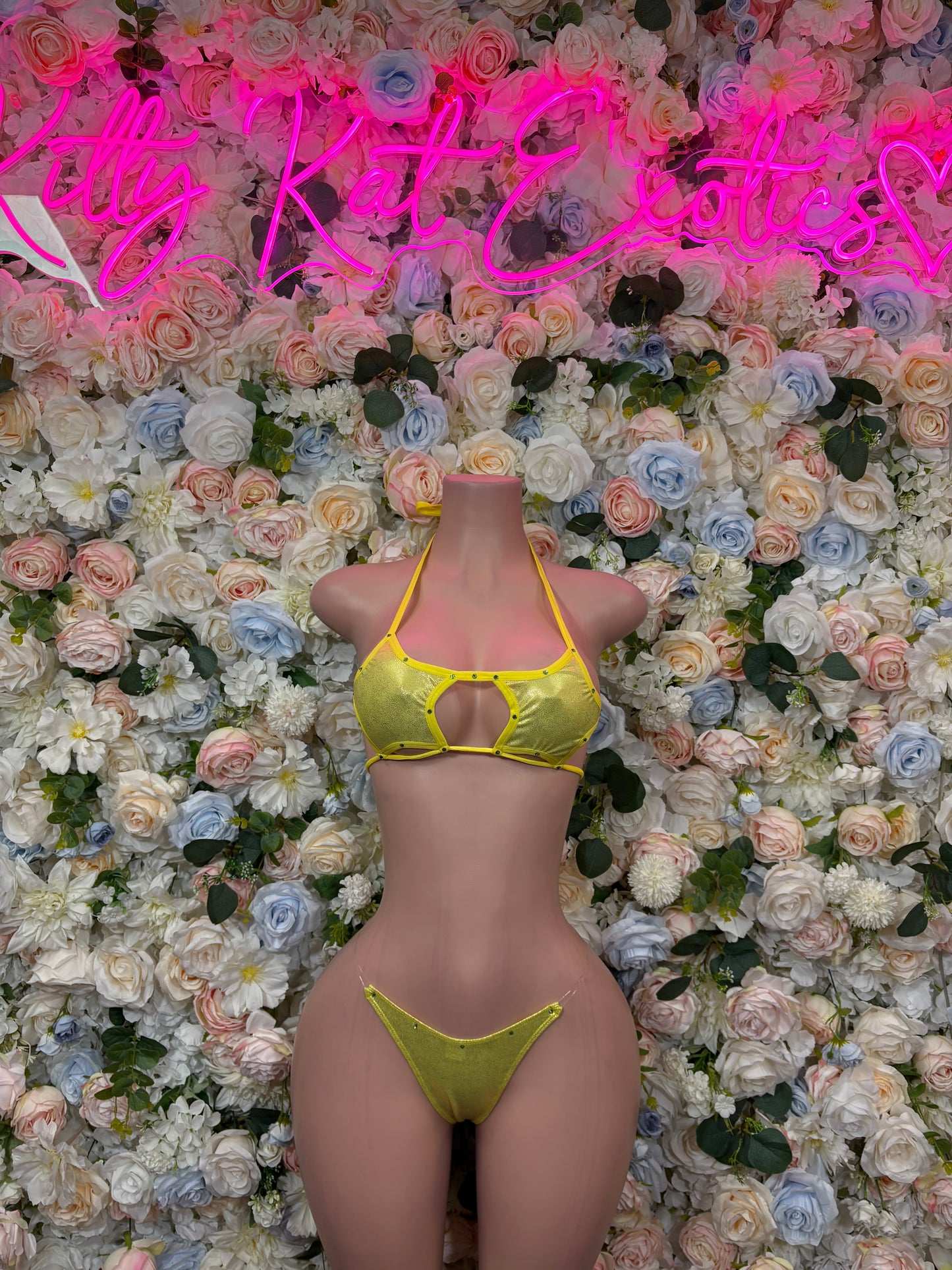 Yellow two-piece lingerie set with triangle bra and high-cut thong bottoms, thin straps