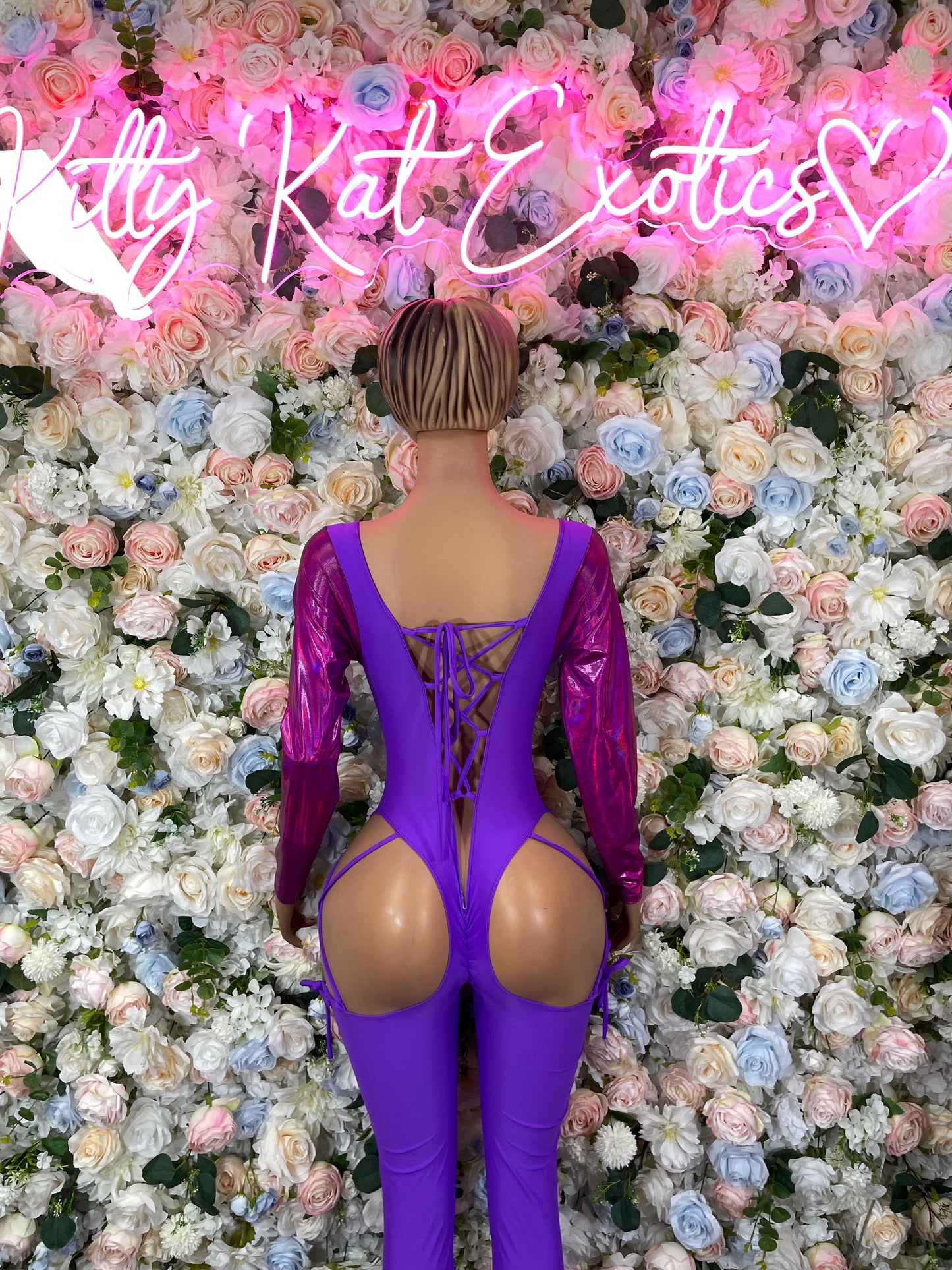 Purple long-sleeve one-piece bodysuit with crisscross lace-up back and large back cutouts