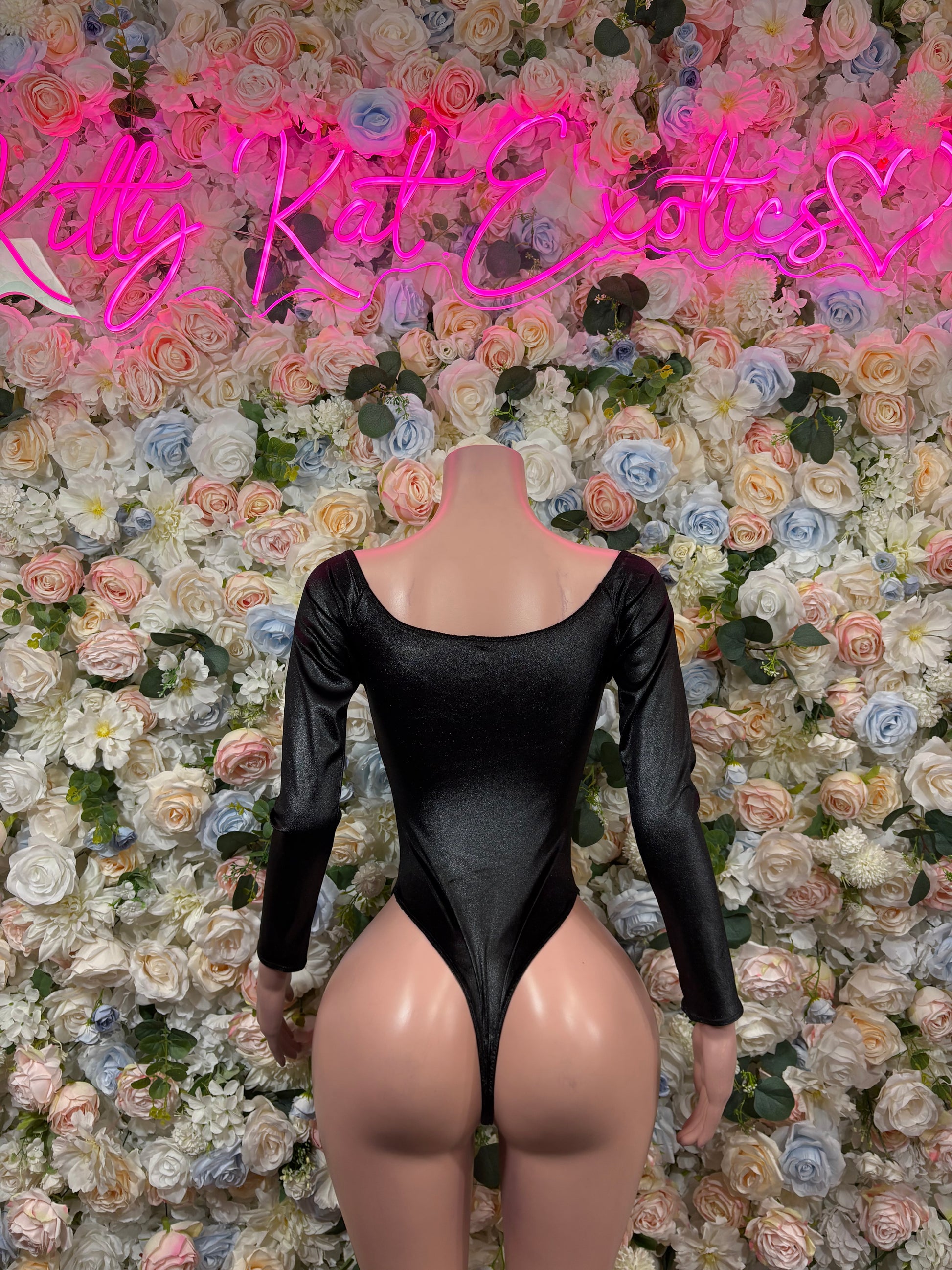 Black long-sleeve bodysuit with scoop back and high-cut legs