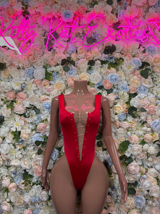 Red bodysuit with deep V neckline and long sleeves, high-cut, on mannequin
