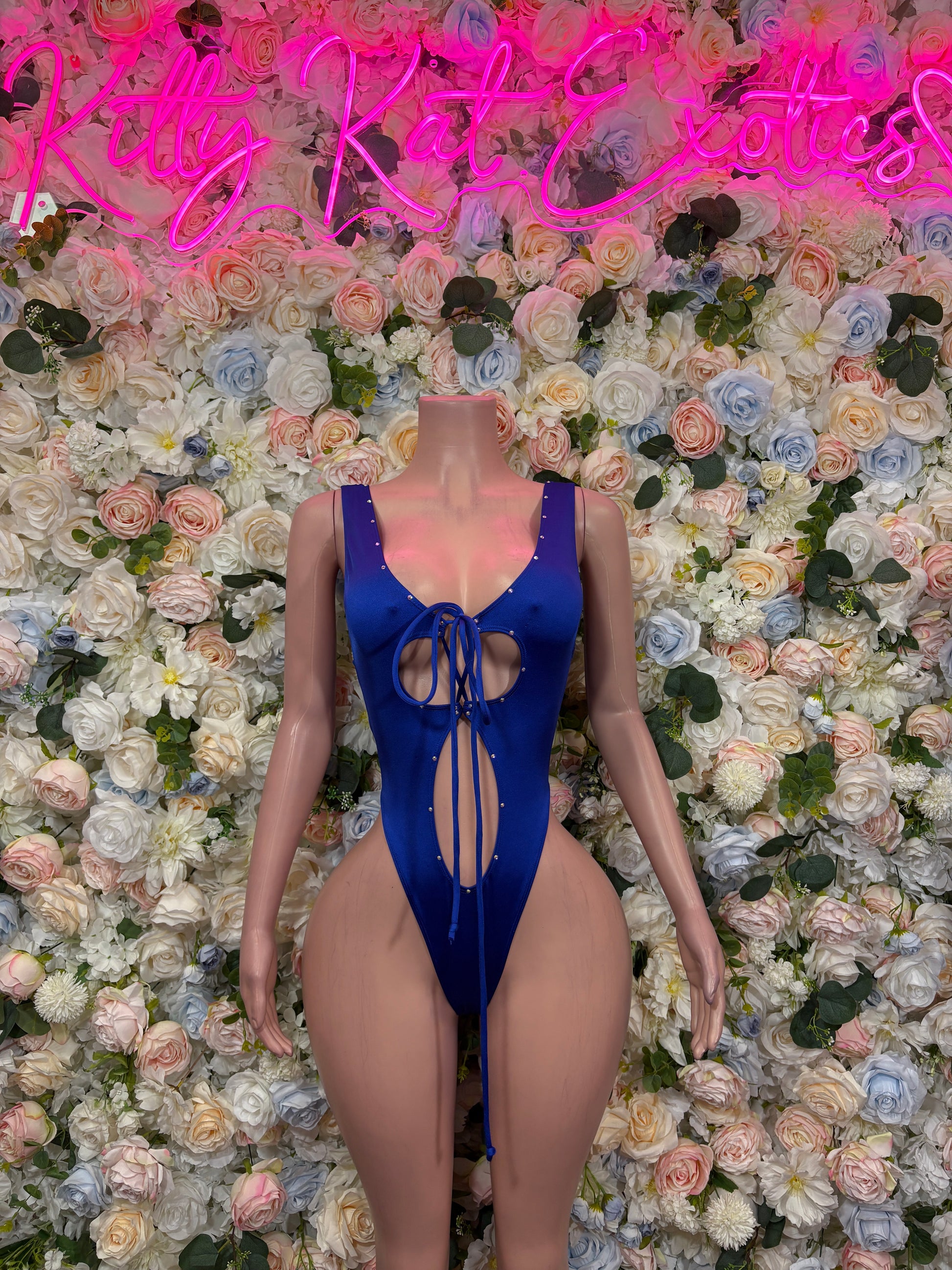 Blue one-piece rave bodysuit with V-neck, tie-front, and open back