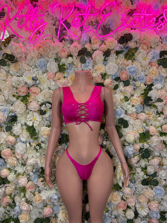 Hot pink two-piece bikini dance outfit with lace-up front top and matching thong bottoms