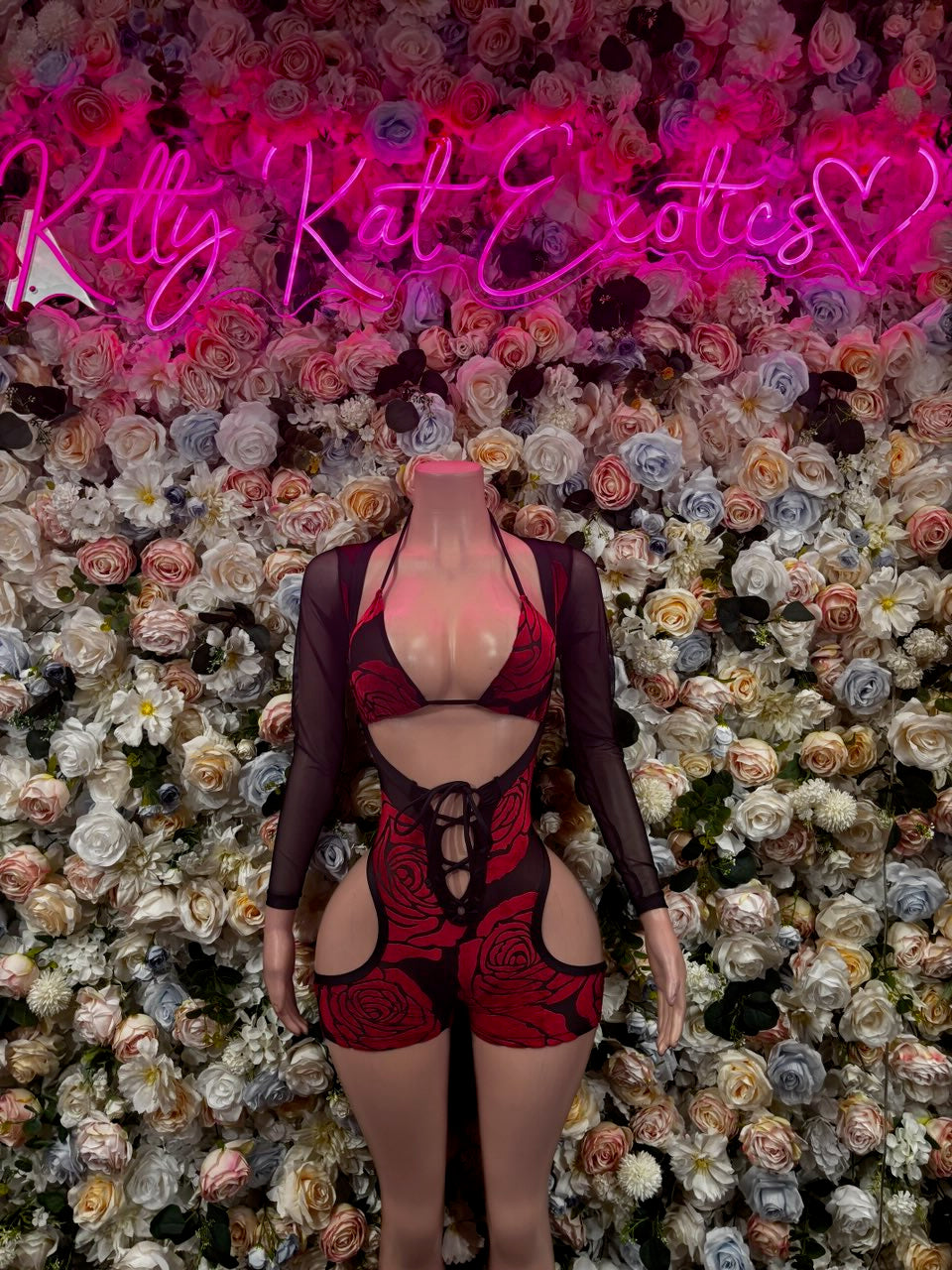 Black sheer long-sleeve bodysuit with red rose print and lace-up front cutout