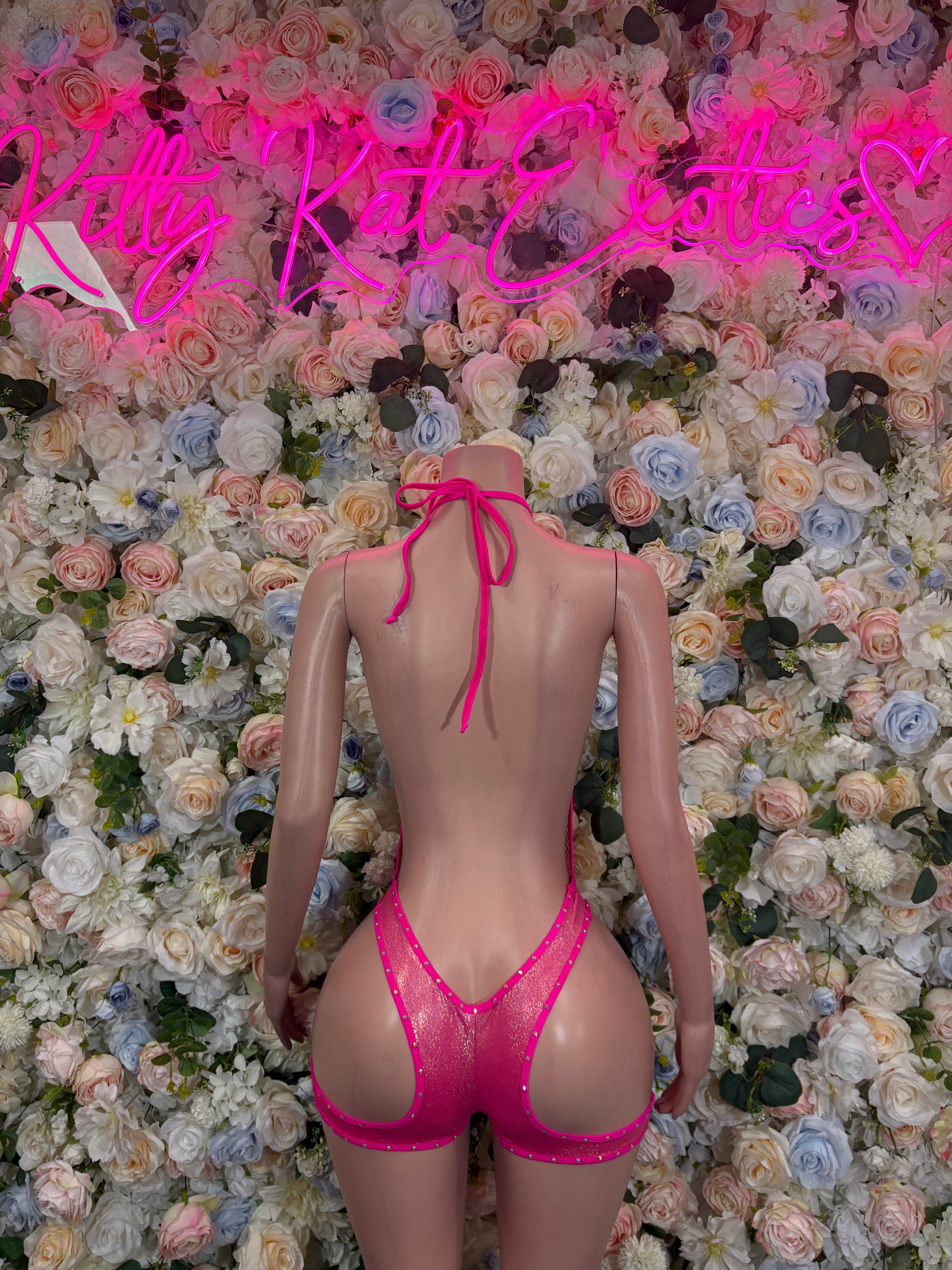 Pink strappy bodysuit with tied back and vertical rhinestone design, V back neckline