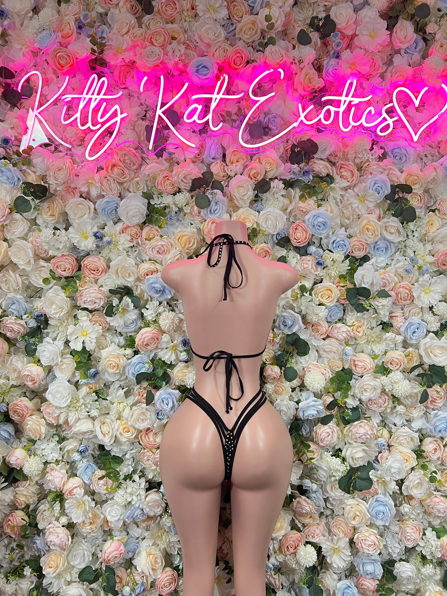 Black rhinestone string bikini with triangle cups and tie-back bottoms, front view