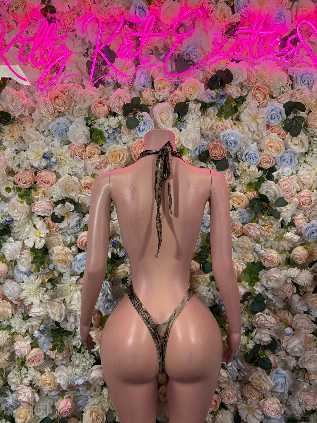 Camo print bodysuit with open back and tie straps, high-cut thong style