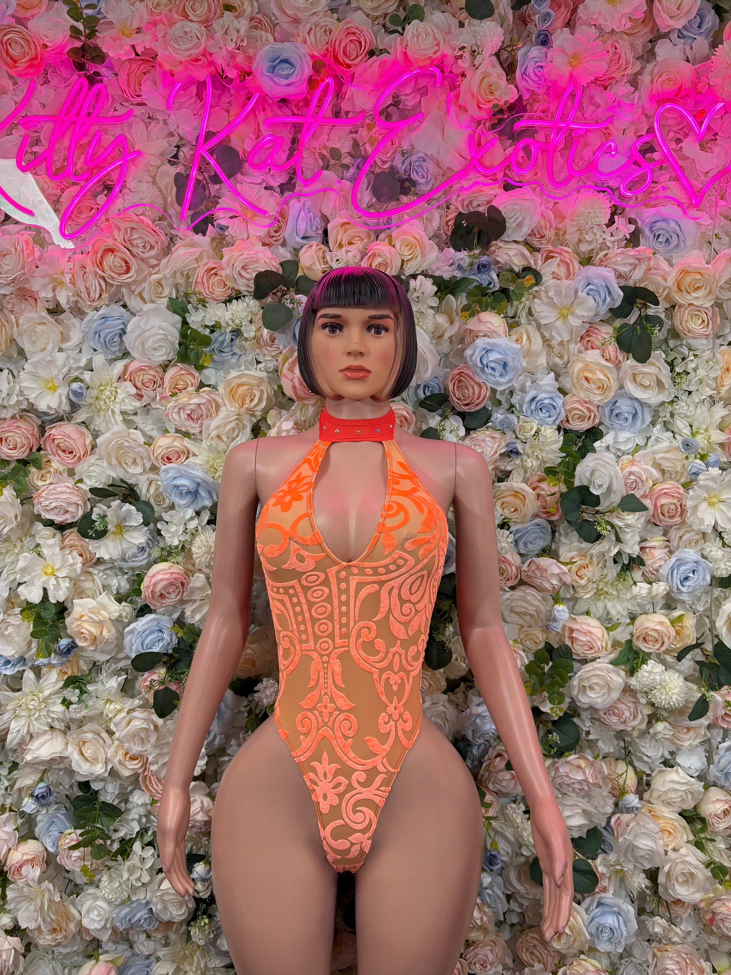 Orange halter one-piece bodysuit with high neck and scalloped front pattern