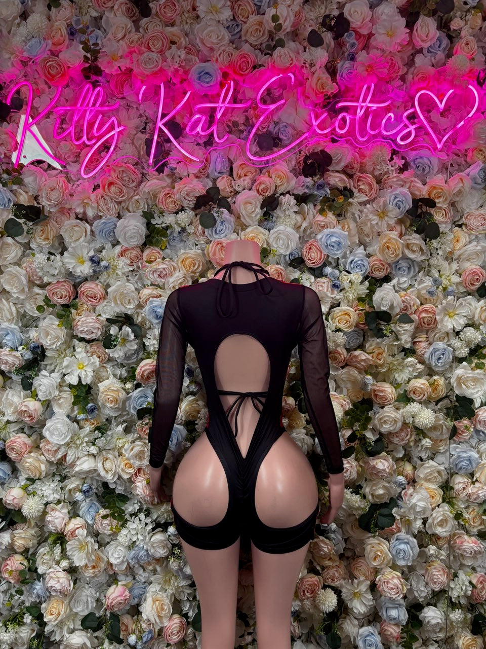 Black sheer backless bodysuit with red rose print and mid-back cutout
