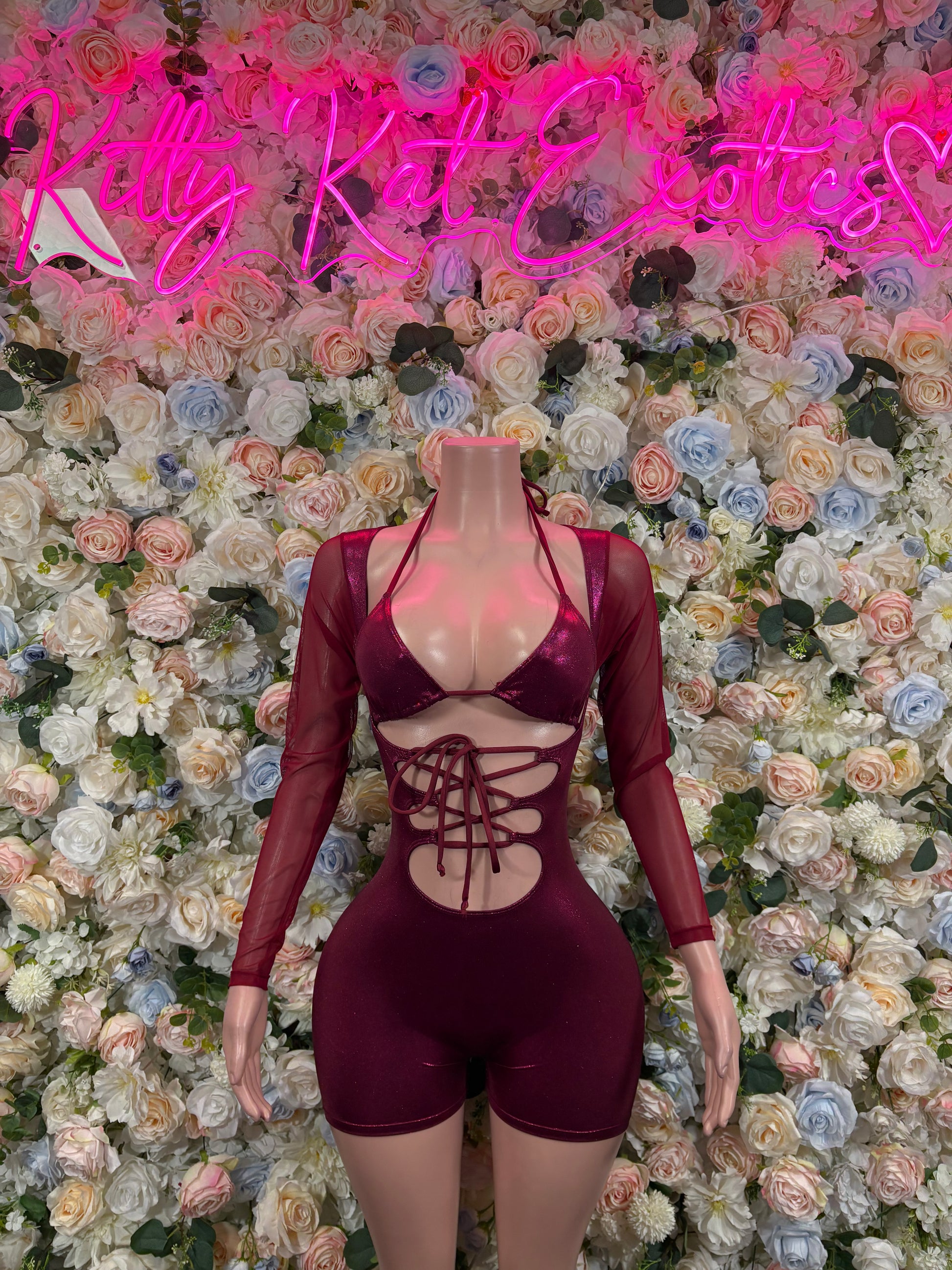 Burgundy long-sleeve one-piece bodysuit with lace-up front cutouts