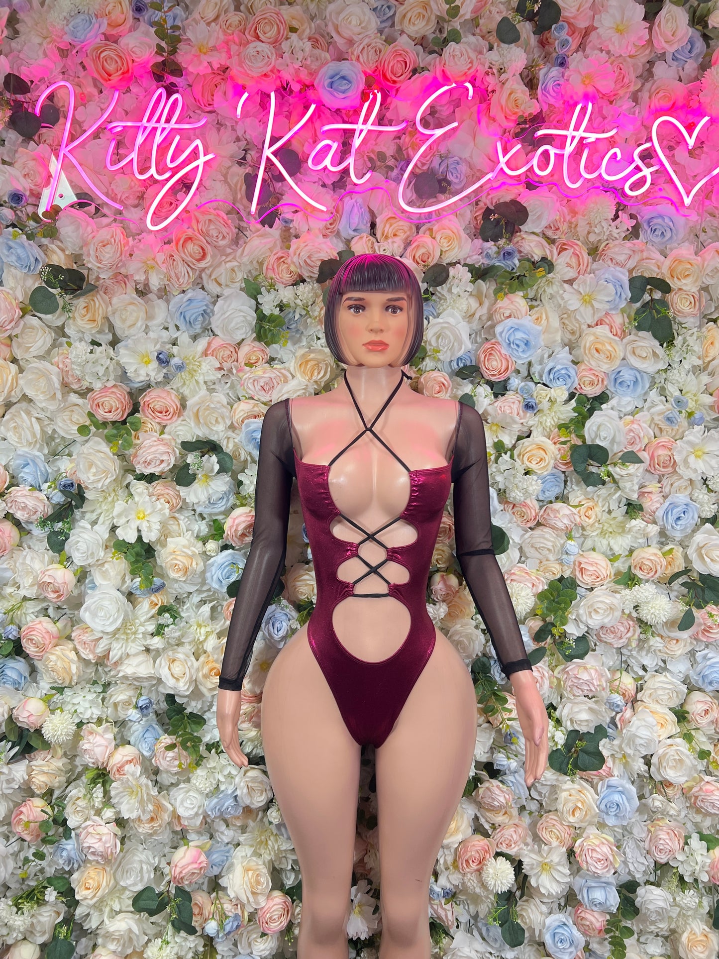 Burgundy dance bodysuit with crisscross front cutouts and long sheer sleeves