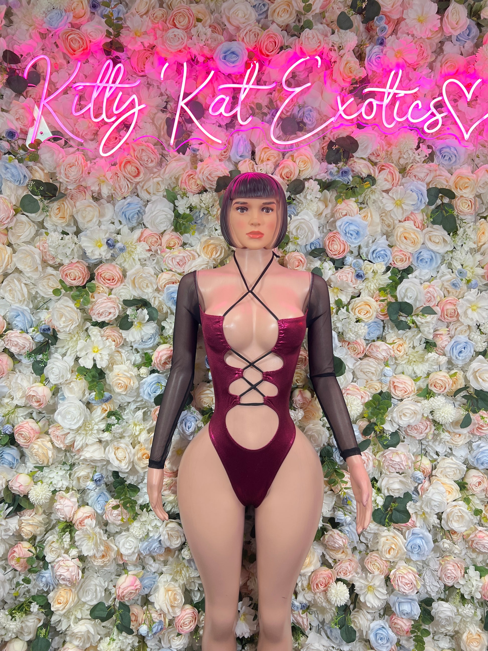 Burgundy dance bodysuit with crisscross front cutouts and long sheer sleeves