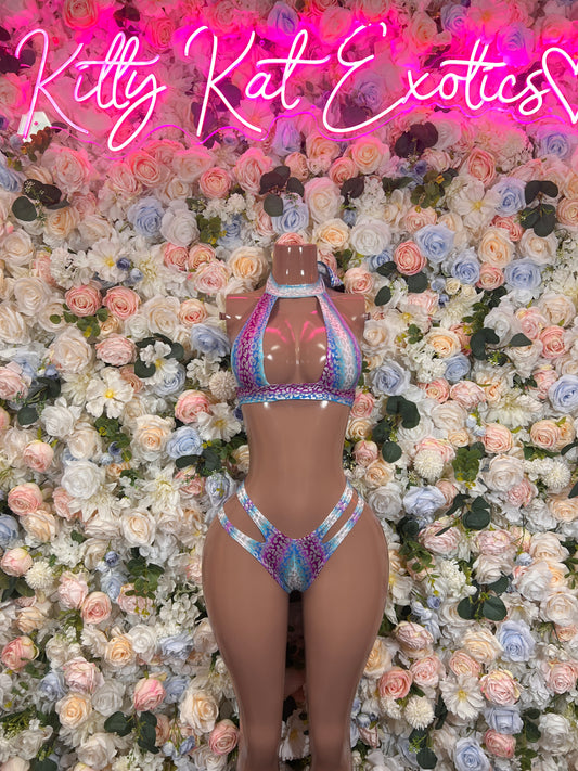 Holographic iridescent bikini set on mannequin with triangle top and high-rise strappy bottoms