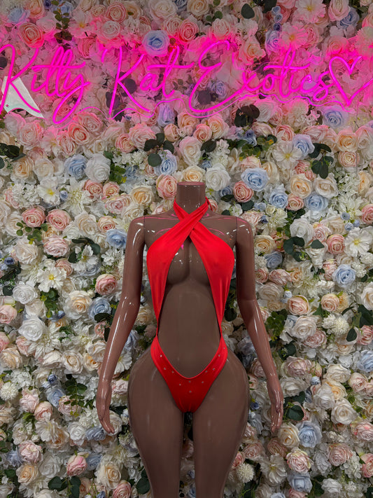 Red halter bodysuit with crisscross chest and high-cut legs