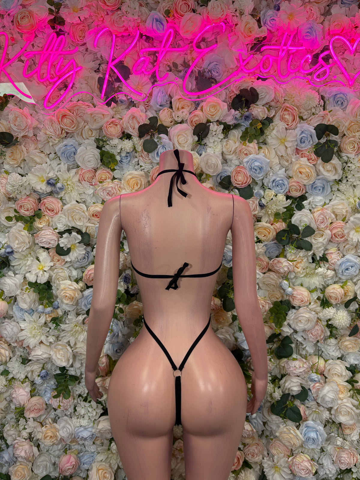 Black metallic monokini bodysuit with halter straps and high-cut open back