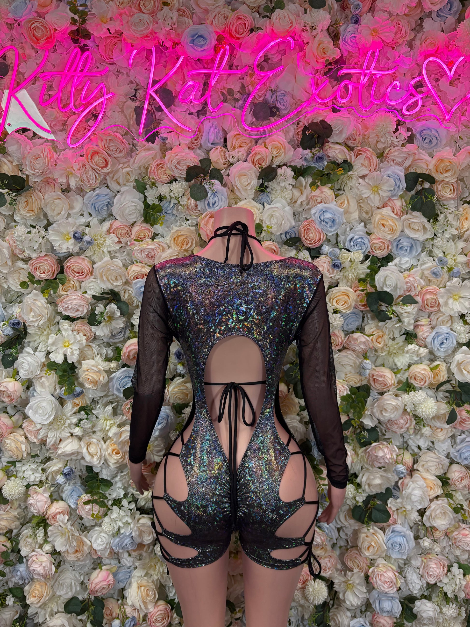 Black metallic bodysuit with sheer sleeves and crisscross lace-up open-back straps