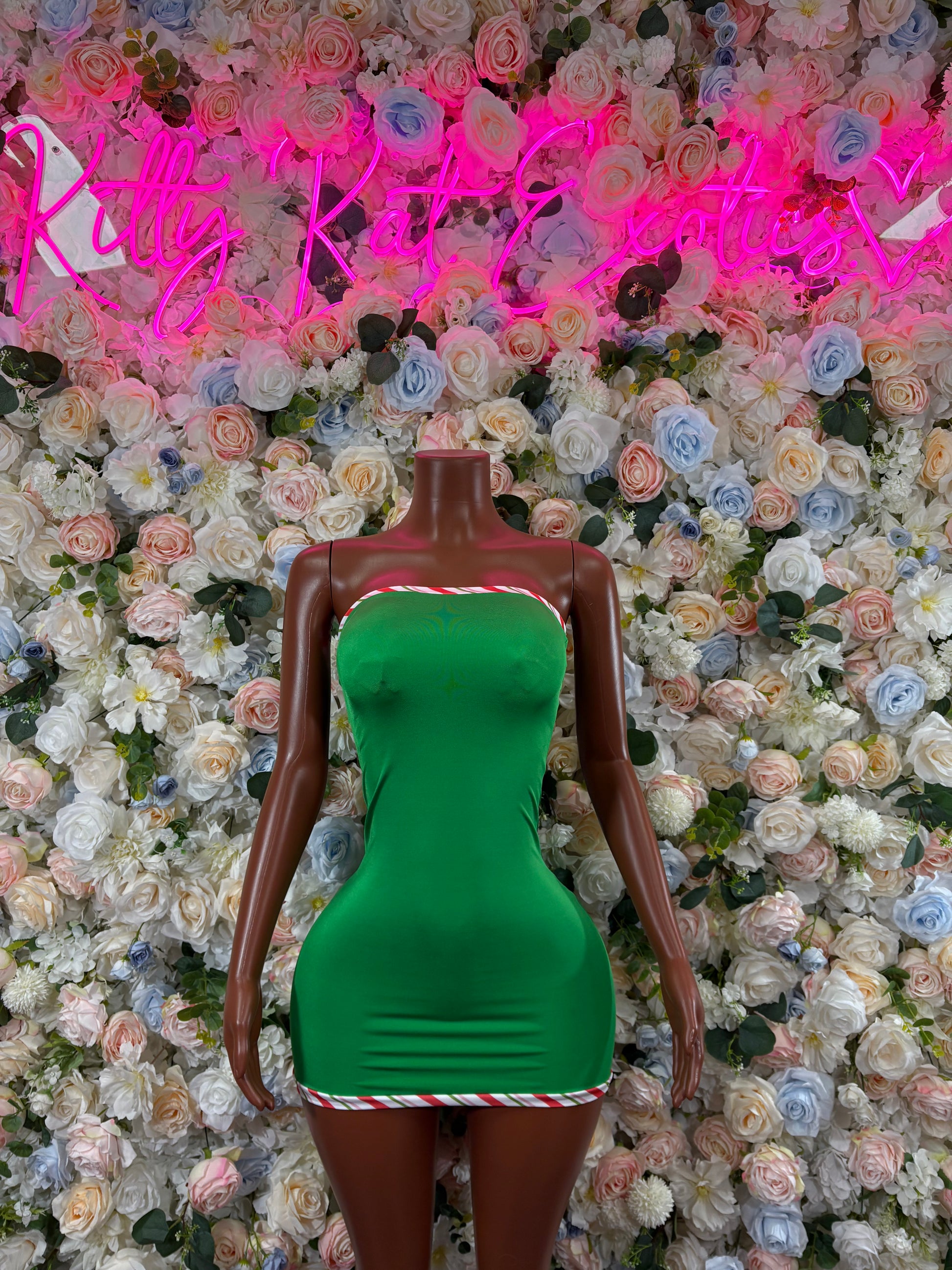 Green bodycon mini dress with candy-cane striped trim (front)