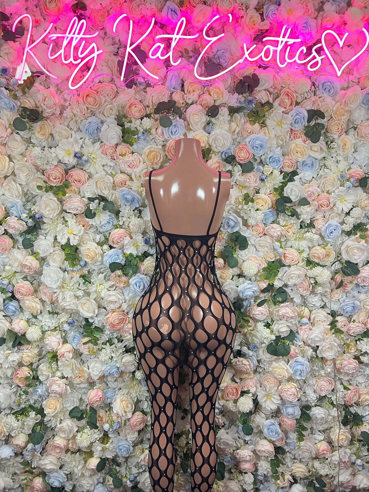 Black fishnet sleeveless bodysuit with oval ring pattern