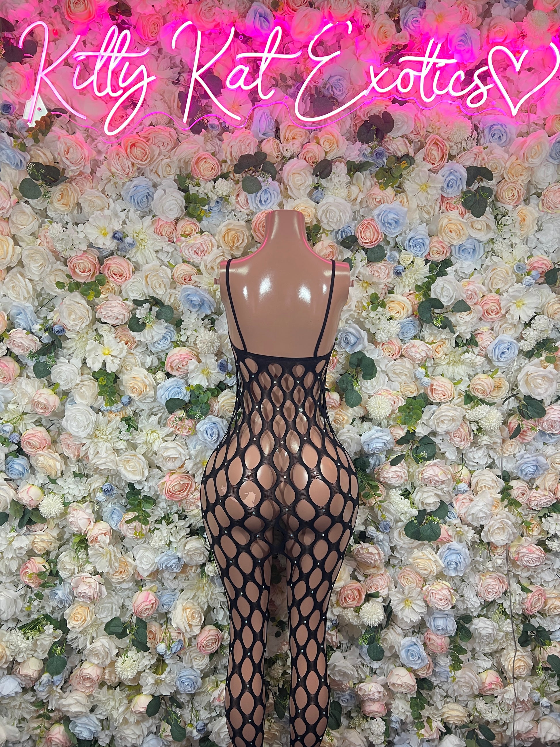 Black fishnet sleeveless bodysuit with oval ring pattern