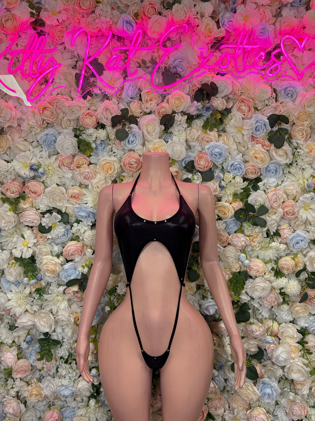 Black metallic monokini bodysuit with open front cutout and halter neckline