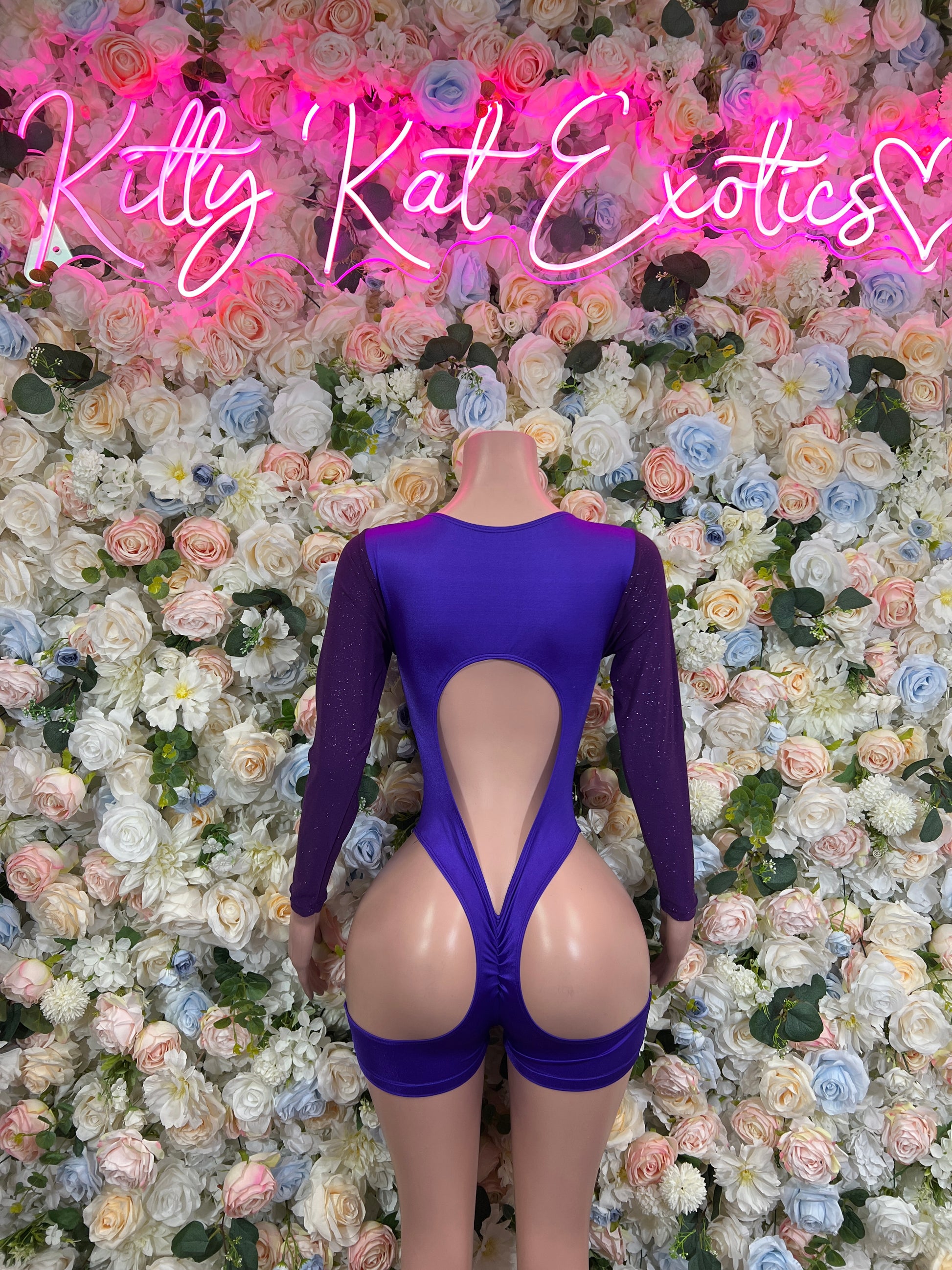 Purple long-sleeve bodysuit with open back and deep V back cutout
