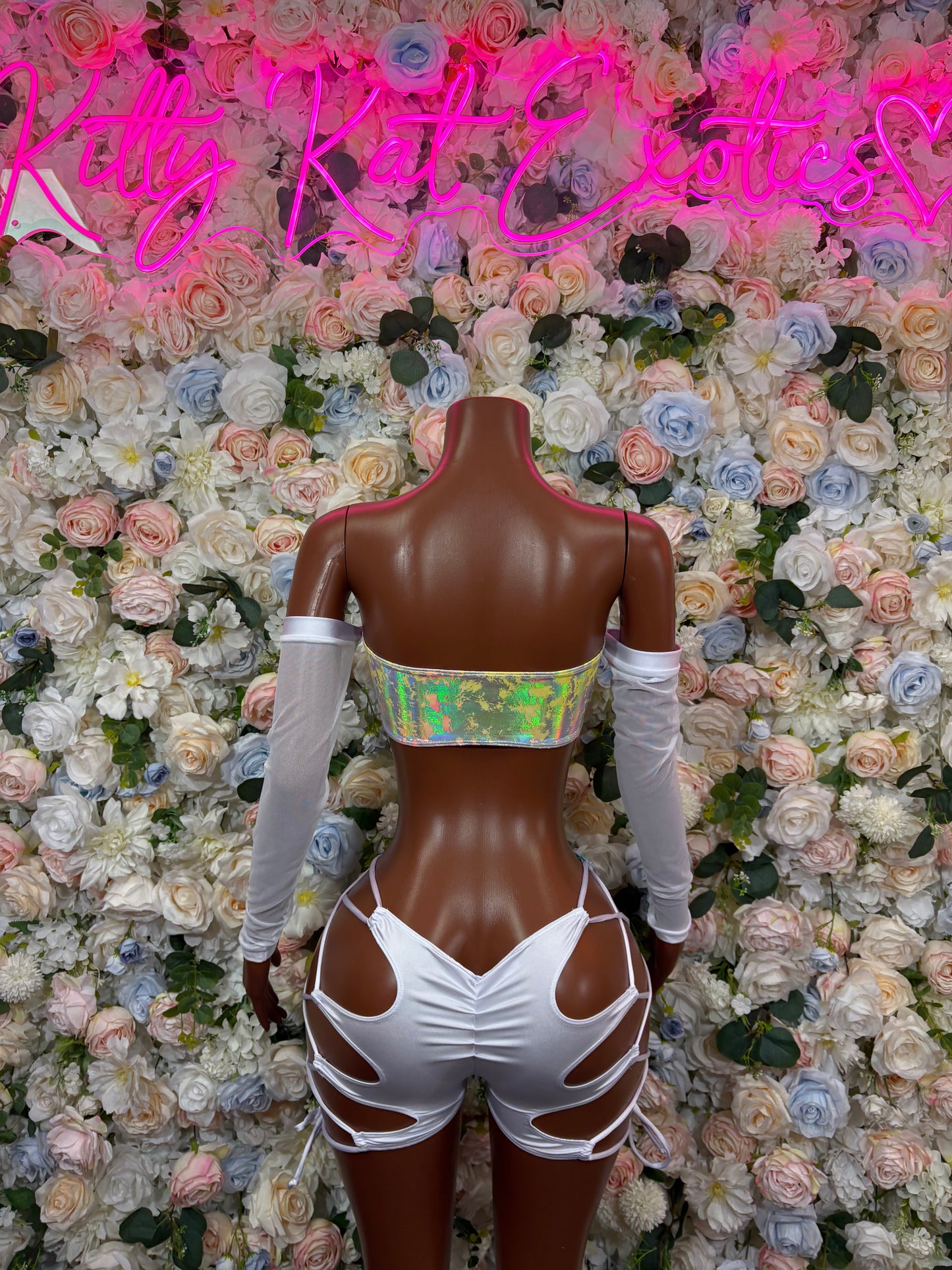 Rainbow hologram bodysuit with white back crisscross straps and sheer sleeves