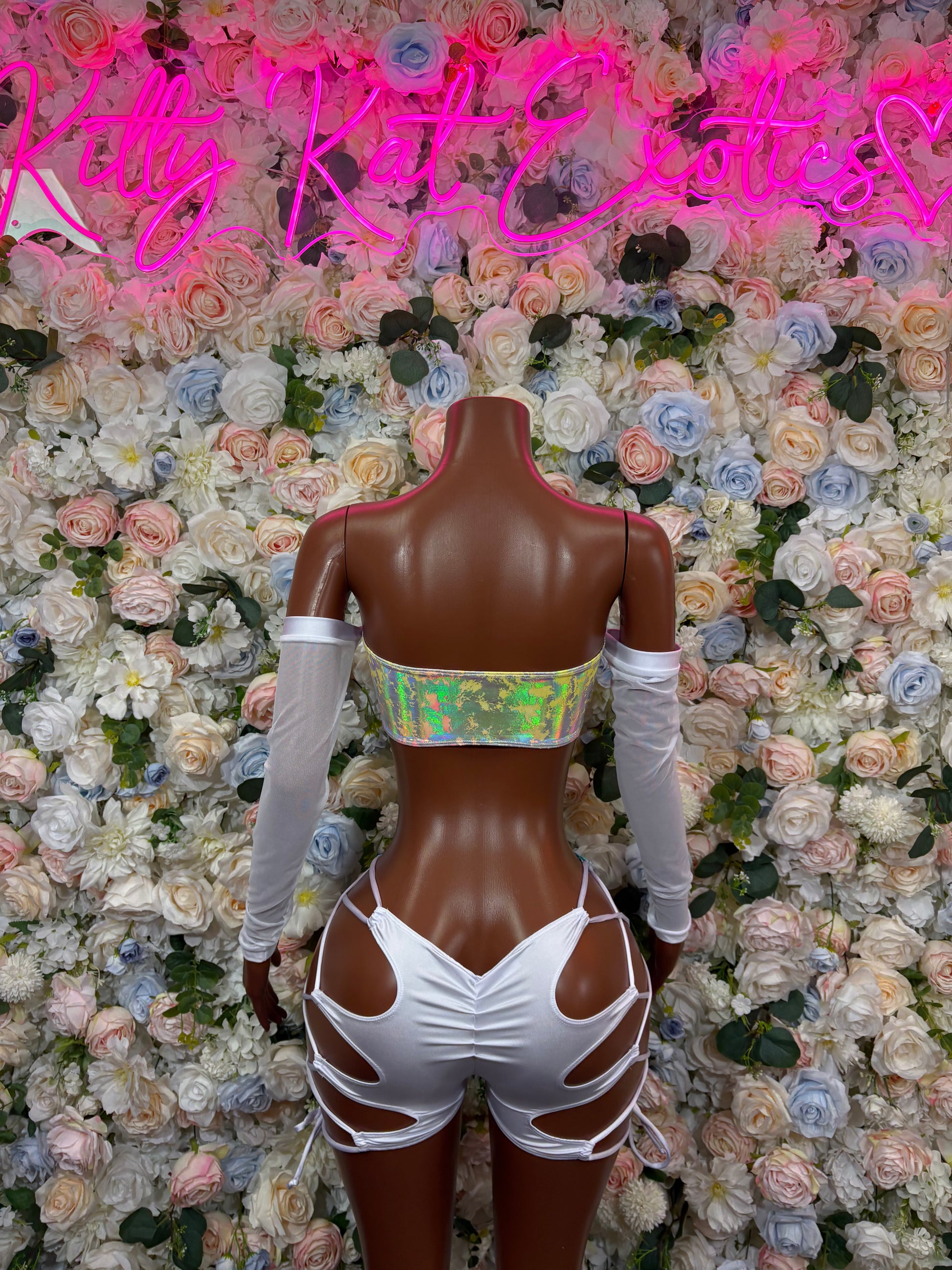 Rainbow hologram bodysuit with white back crisscross straps and sheer sleeves