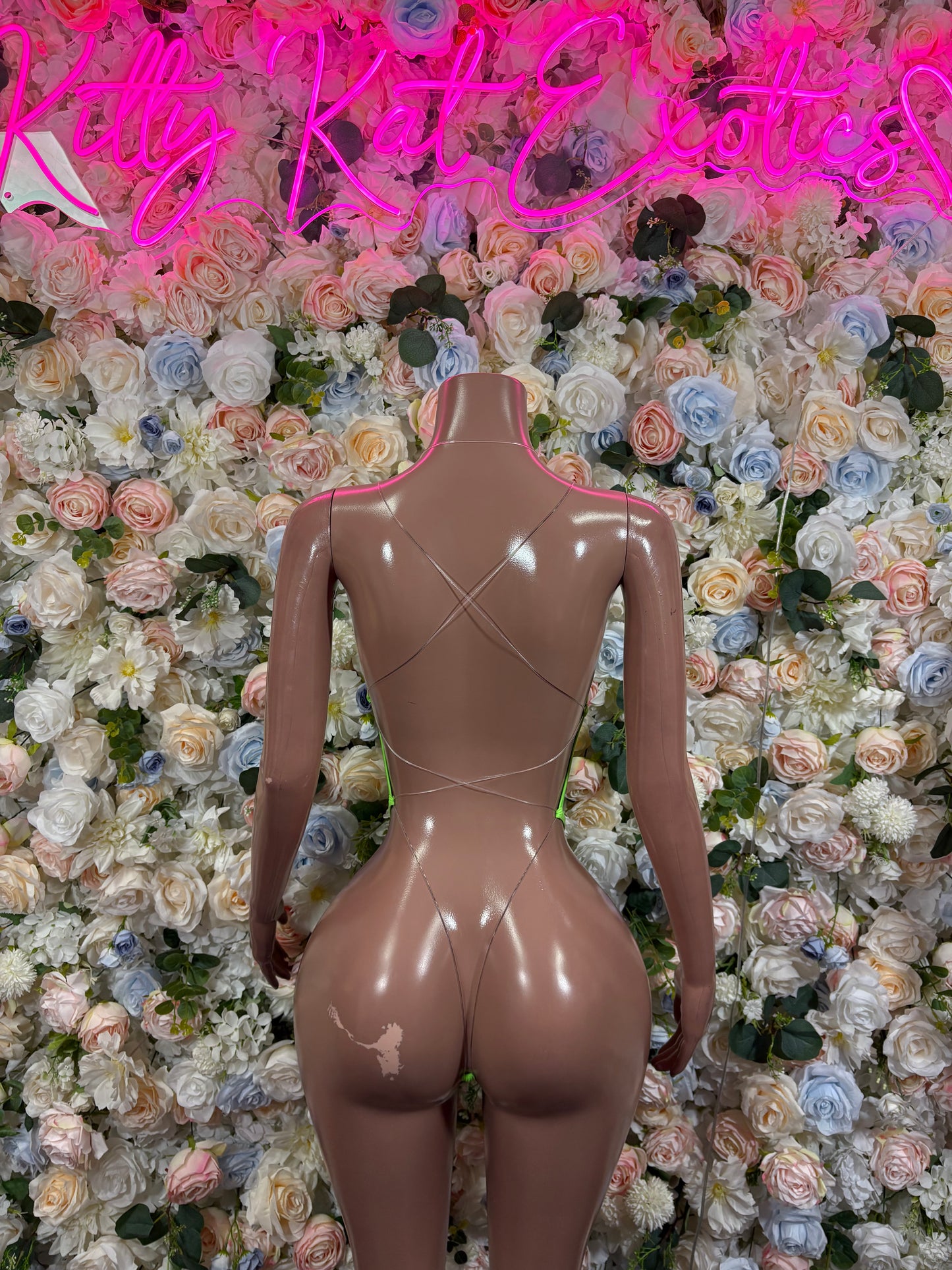 High-cut one-piece with cross straps and open back