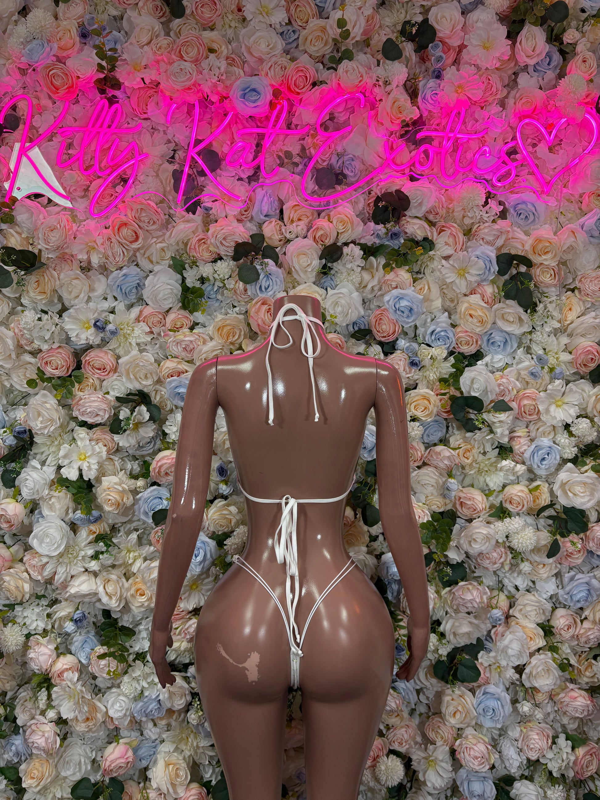 White rhinestone bikini back view with thin tie straps and sparkly bow detail