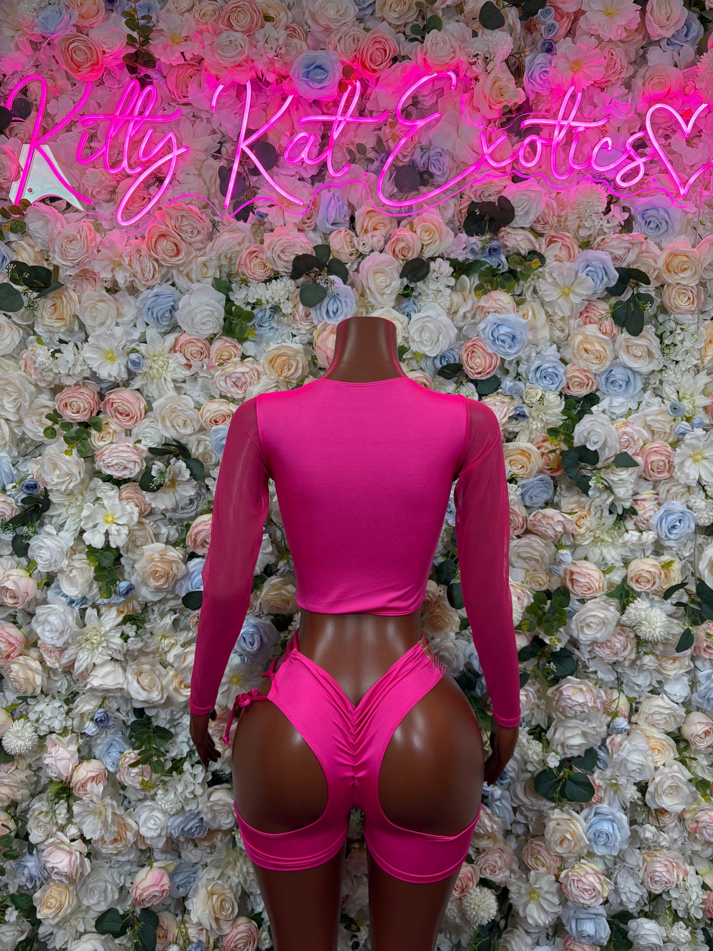 Pink hologram dancewear set, long-sleeve crop top and lace-up mini shorts (back)