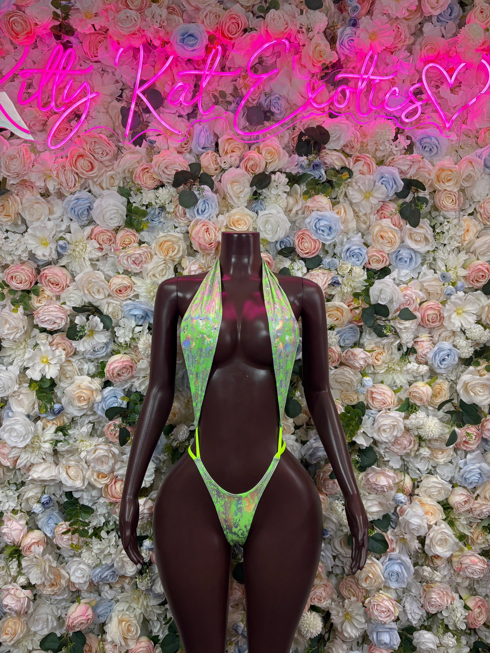 Metallic green rave bodysuit with halter neck and high-cut front, neon trim details