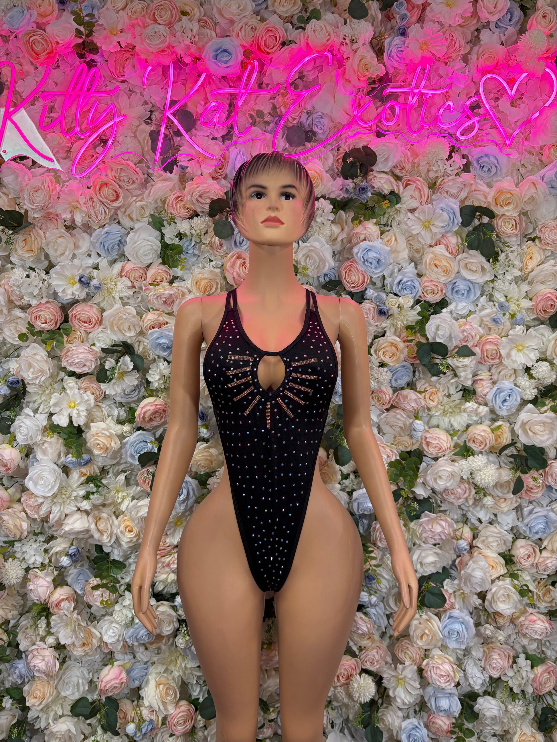 Black rhinestone sleeveless bodysuit with center bust ring detail.