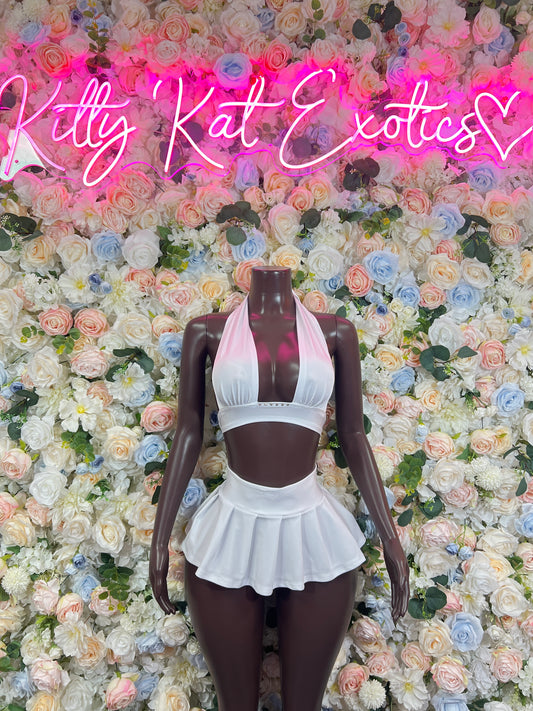 White two-piece rave set with halter crop top and ruffled mini skirt, front view