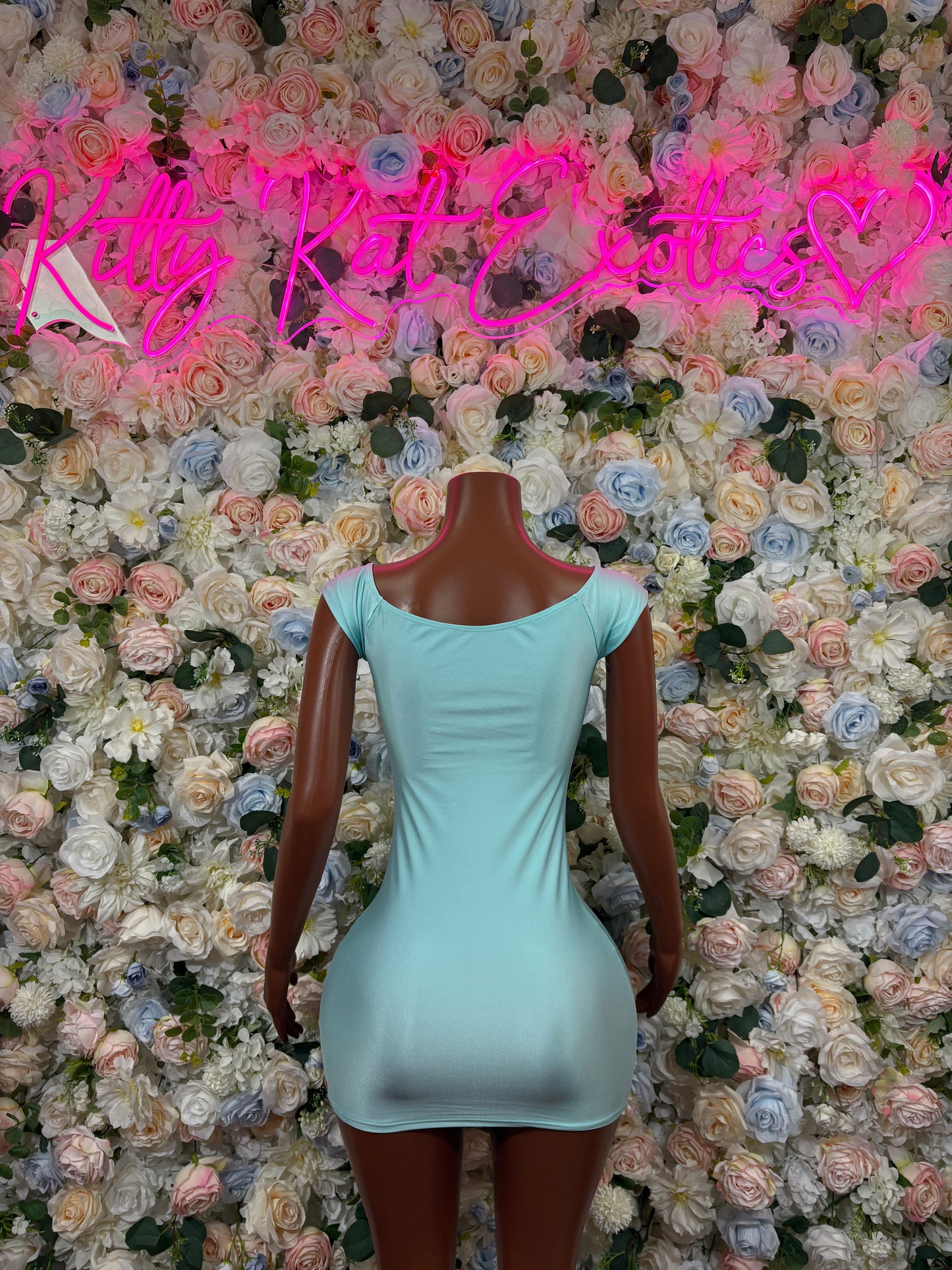 Teal sleeveless mini dress with open-back oval cutout