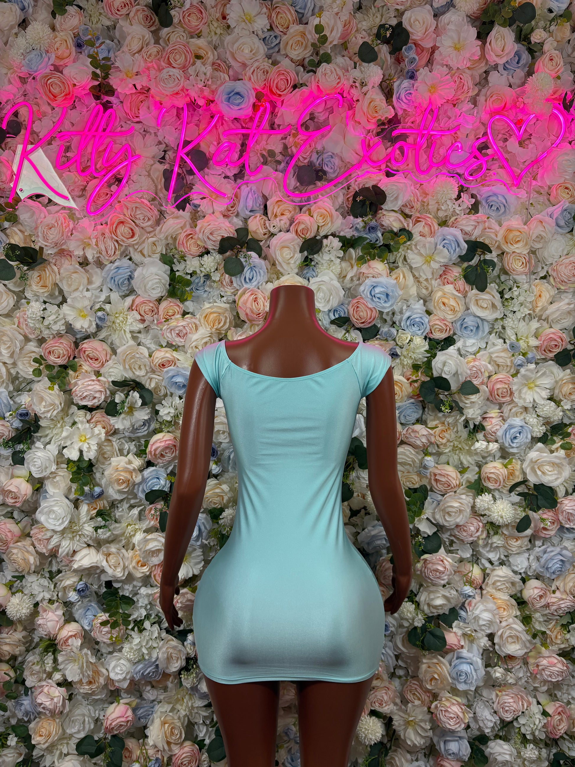Teal sleeveless mini dress with open-back oval cutout