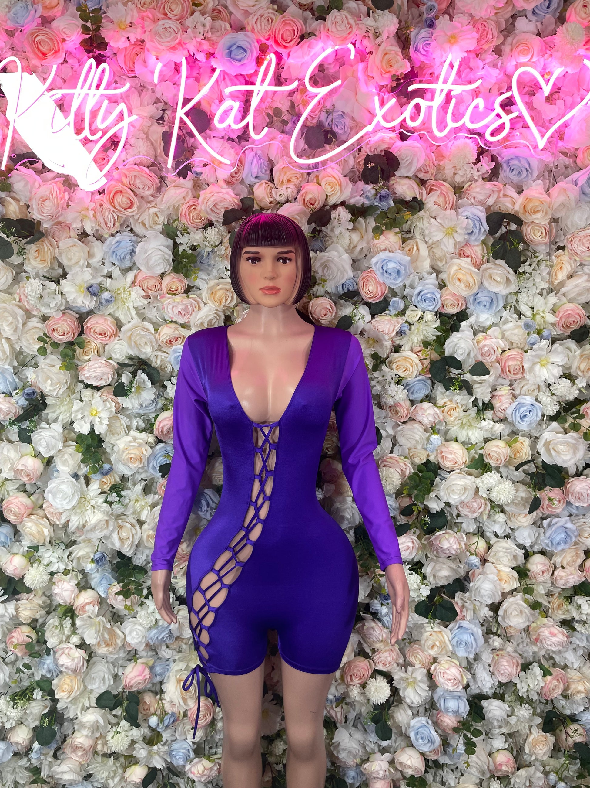 Purple long-sleeve one-piece bodysuit with crisscross lace-up front