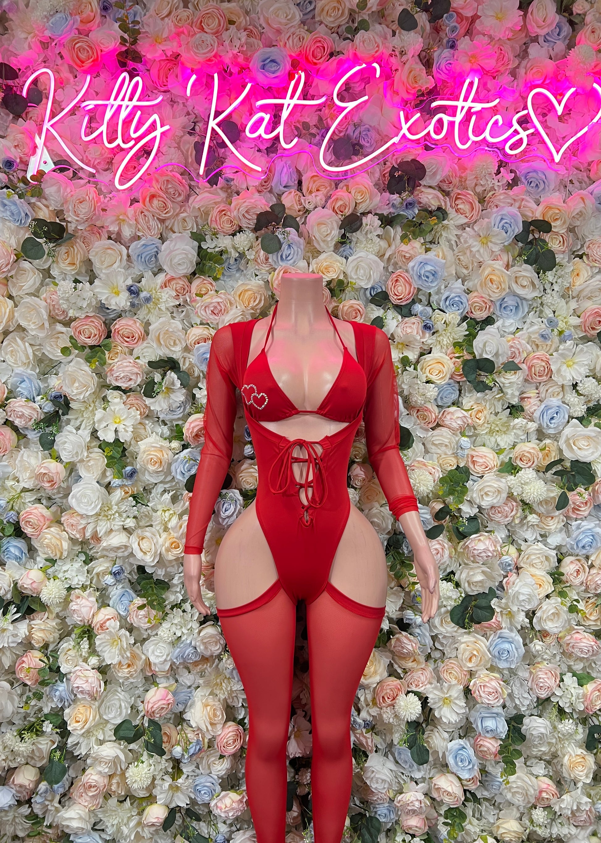 Red lace-up bodysuit with heart cutout and long sleeves